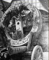 Slogan on the wheels. Swastika